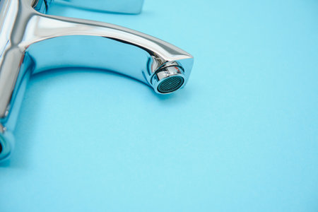 New chrome or steel mixer tap for bathroom sinks