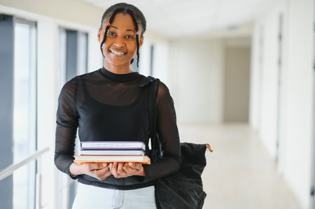 portrait of happy female african american college studentの写真素材