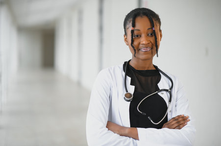 african american female doctor in hospital corridorの写真素材