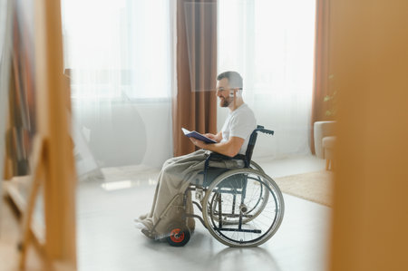 Young handsome man in wheelchair.の写真素材