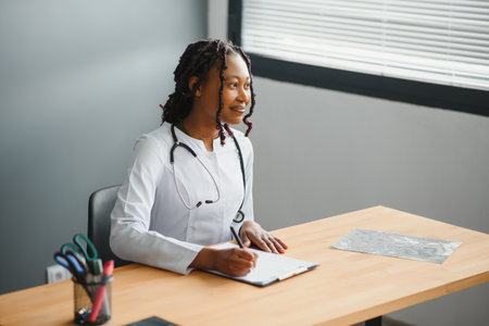 Portrait Of Female Doctor Wearing White Coat In Officeの写真素材