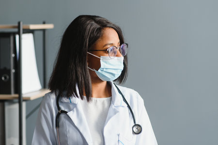 African female doctor in protective facial mask.の写真素材