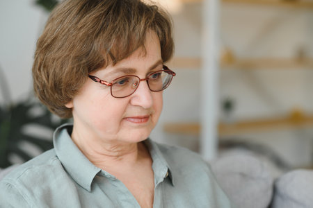 Close-up portrait of a happy older woman at home.の写真素材