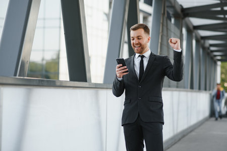 Handsome male model posing wearing a back suitの写真素材