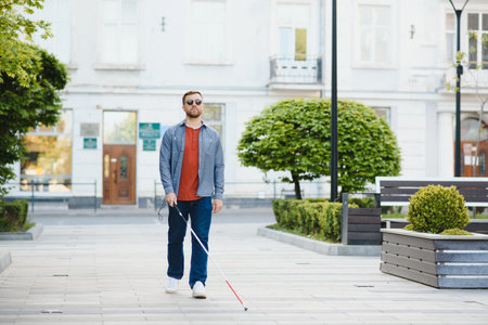 blindman. People with disability, handicapped person and everyday life. Visually impaired man with walking stickの写真素材