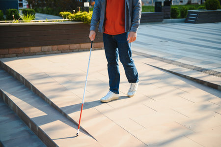 Close-up Of A Blind Man Standing With White Stick On Street.の写真素材