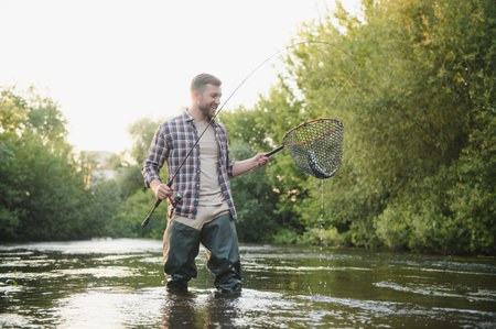 Trout fishing on mountain river.の写真素材