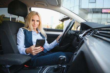 Portrait of business elegant middle-aged woman in carの写真素材