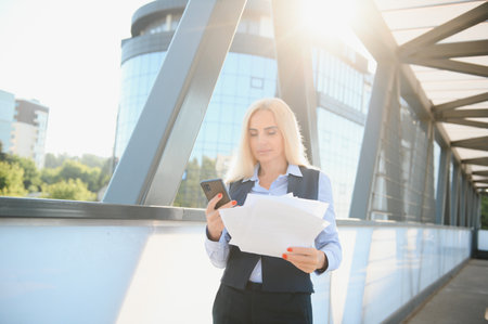 Portrait of a business woman using a cell phone.の写真素材