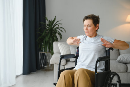 woman in wheelchair working out in living room.