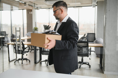 Old businessman employee in relocation concept.の写真素材