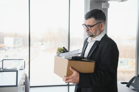 Old businessman employee in relocation concept.の写真素材
