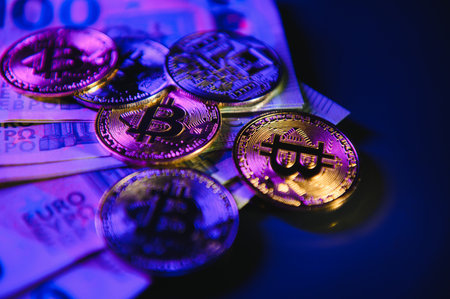 bitcoins on a background euro bills. Bitcoin as new money, Stock Market of cryptocurrencies and decentralized finances concept.の写真素材