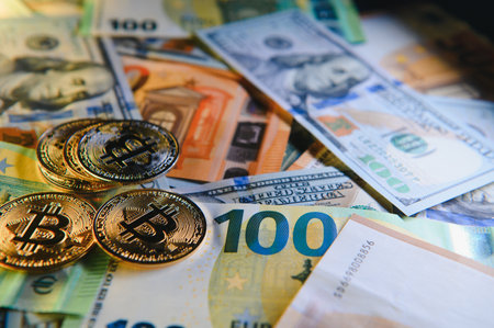 euro banknotes and coins, dollar banknotes with bitcoin. high quality photoの写真素材