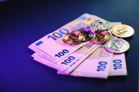Golden bitcoin over euro money. bitcoin cryptocurrency. Cryptocurrency concept. Bitcoin with euro...