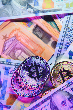 euro banknotes and coins, dollar banknotes with bitcoin. high quality photoの写真素材