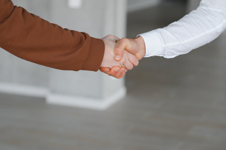 Close-up image of a firm handshake standing for a trusted partnership.