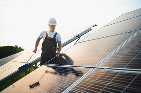 man cleaning, solar power washing.の写真素材