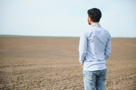 Young Indian farmer in his field.の写真素材