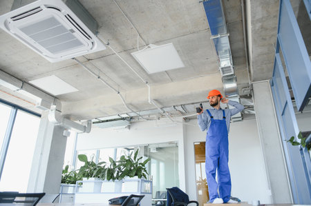 hvac engineer install heat recovery ventilation system for new house. copyspace,の写真素材