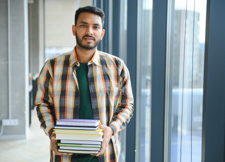 Handsome and young indian male college student