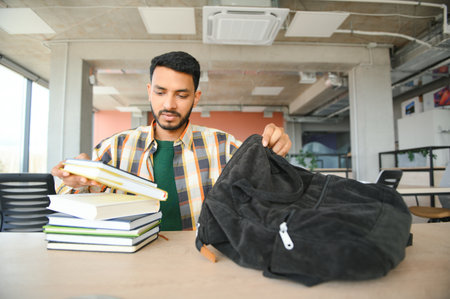 Handsome and young indian male college student