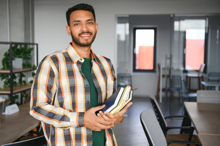 Happy indian male student at the university.の写真素材