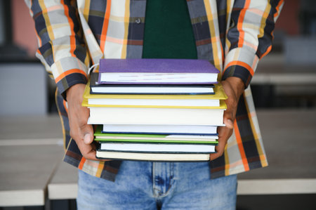 indian student with books at university.の写真素材