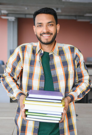 Happy indian male student at the university.の写真素材