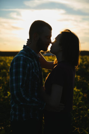 beautiful couple together watching a beautiful sunset.の写真素材