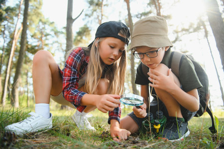 kids in green forest playing,concept of kids vacations and travel.