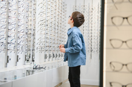boy in glasses, at optics store.