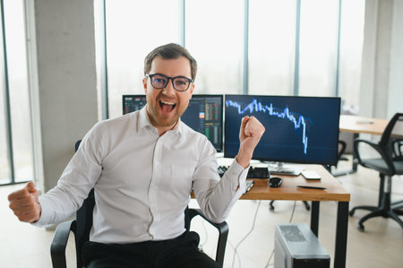 Successful trader in formalwear checking cryptocurrency information data on finance market graph, working in office.の写真素材