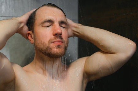 Man warming up in the shower.
