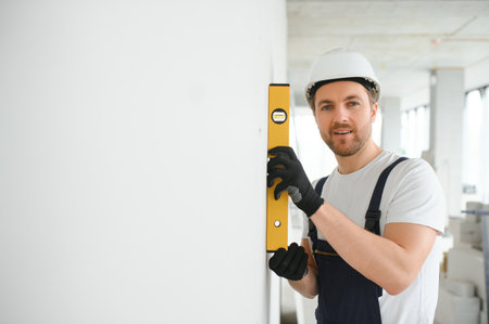 A happy worker proudly standing at his workplace