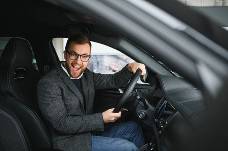 His true love. Portrait of a mature man smiling happily sitting in a brand new car.の写真素材