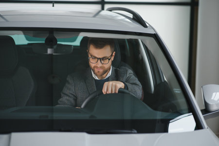 His true love. Portrait of a mature man smiling happily sitting in a brand new car.