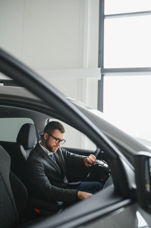 Handsome male taxi driver in carの写真素材