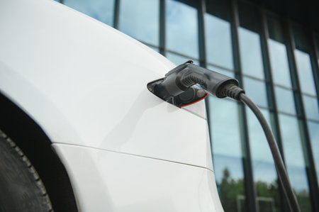 Close up image of the power socket of an electric car, charging.