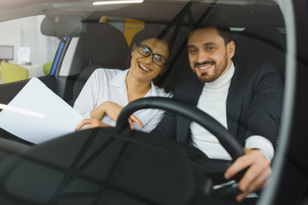 Young business people working together while traveling by a car.の写真素材