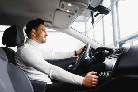 Male hand on the shift lever of the transmission in the carの写真素材