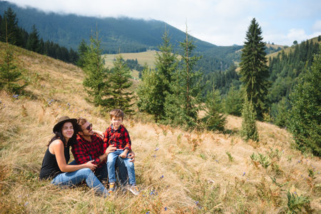 young family on active vacation in the mountains. Travel to the mountains for summer vacation. national park.の写真素材