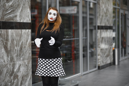 Portrait of a mime comedian. mime girl on the street