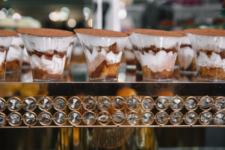 Traditional Italian dessert tiramisu in a glass on dessert table.の写真素材