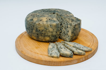 Isolated Holland Gouda cheese on a white background.の写真素材