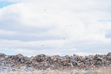 huge pile of garbage in a city dump on gloomy day. Keeping the environment clean. ecological problems.の写真素材