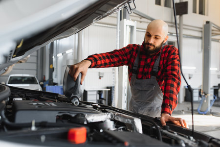 Portrait of a mechanic at work in his garageの写真素材