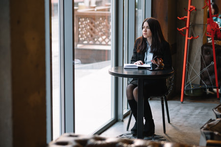 businesswoman talking on the phone and taking notes.の写真素材