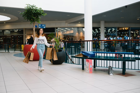 shopping. Shopping time, teenage girl with shopping bags at shopping mallの写真素材