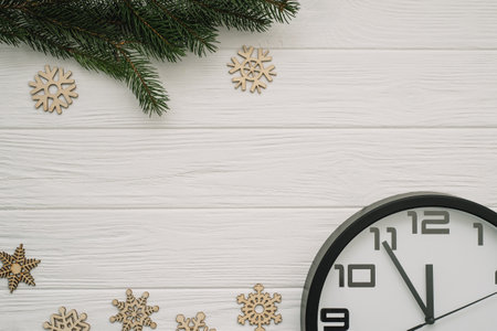 Christmas fir tree with decoration and glitters on wooden background. Christmas background on the...